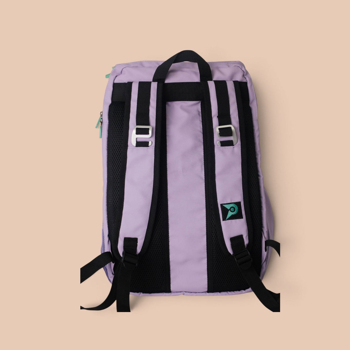 Back view of a lavender PVT Pickleball ARC bag with black padded straps, mesh back cushioning, and fence hooks.