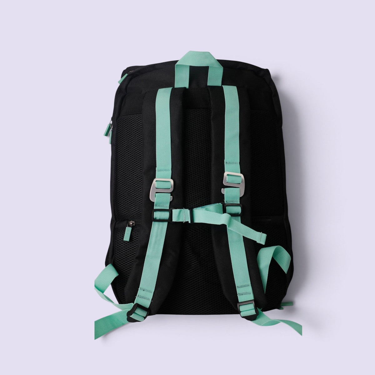 Back view of the PVT Pickleball Bolt bag in black with mint green straps and ergonomic mesh back cushioning.